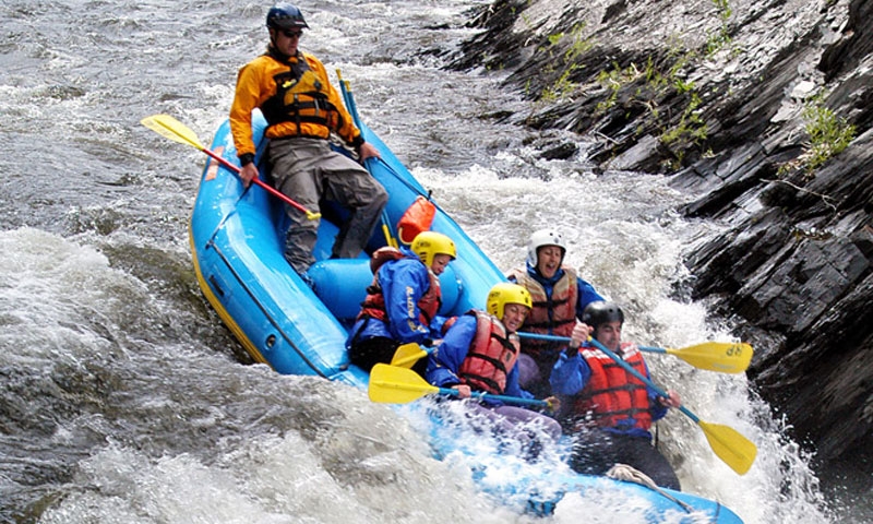 Riding through the Slaughter House Rapid on the Roaring Fork near Aspen